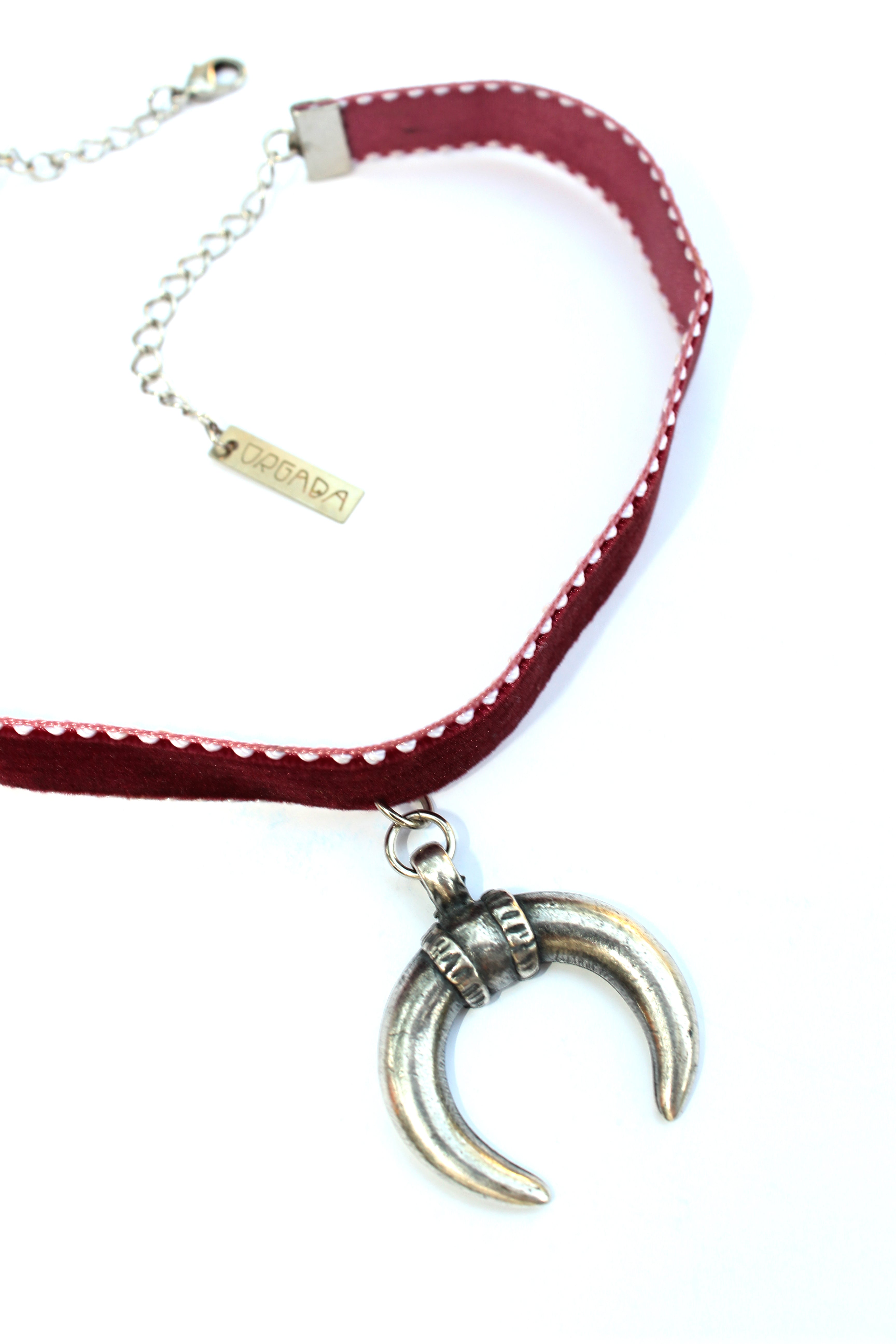Orgada's Maroon Gypsy Luna Choker made with a soft velvet strap and a moon pendant on a white background